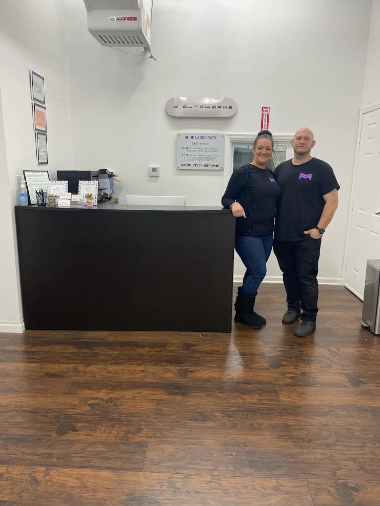 Owner and wife inside the M Autowerks lobby