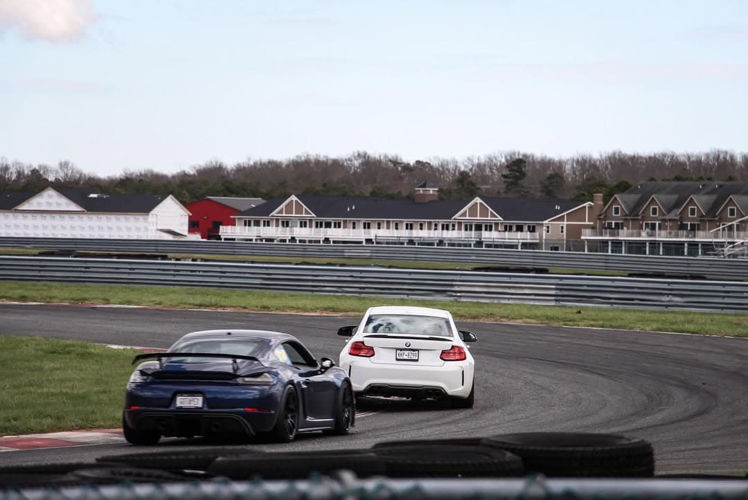 Porsche and BMW on track representing track-prep support